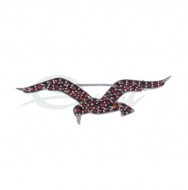 Dámsky šperk v tvare letiaceho vtáka c českým granátom. Kov striebro 925/1000